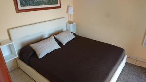 Postel nebo postele na pokoji v ubytování Guest House Brezza Marina