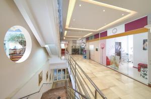 a view of a hallway in a shopping mall at Hotel Dražica - Hotel Resort Dražica in Krk