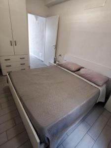 A bed or beds in a room at La Favola di Dani