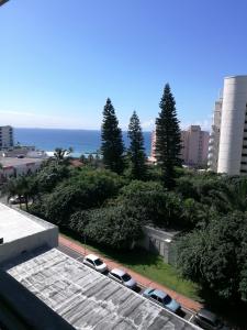 a view of the ocean from the roof of a building at 45 Lighthouse Mall Apartment in Durban