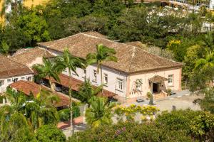 an aerial view of a house with palm trees at Hotel Caldas da Imperatriz in Santo Amaro da Imperatriz