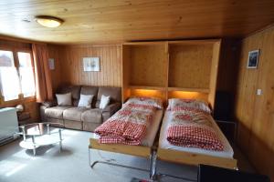 Postel nebo postele na pokoji v ubytování Chalet Bim Chilchli
