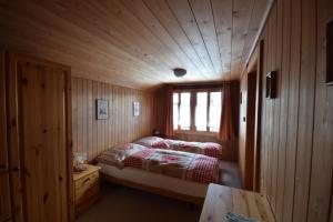 Postel nebo postele na pokoji v ubytování Chalet Bim Chilchli