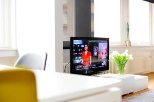 En tv och/eller ett underhållningssystem på Residence Key Inn - Limperstberg