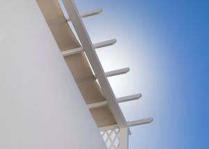 a ladder hanging from the ceiling of a building at Carbonaki Hotel in Mikonos