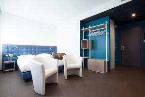 Posteľ alebo postele v izbe v ubytovaní Hotel Carnia