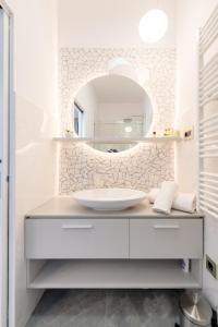 a bathroom with a sink and a mirror at Luxury Rooms L'Avenue Split in Split