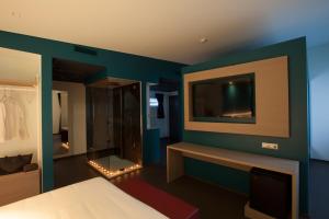 Posteľ alebo postele v izbe v ubytovaní Hotel Carnia