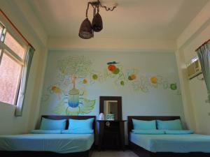 Postel nebo postele na pokoji v ubytování Shin-Liu Garden B&B