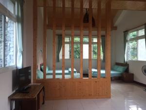 Postel nebo postele na pokoji v ubytování Shin-Liu Garden B&B