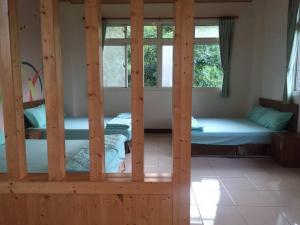 Postel nebo postele na pokoji v ubytování Shin-Liu Garden B&B