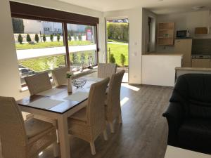 a kitchen and dining room with a table and chairs at Freizeitcenter Bad Sachsa in Bad Sachsa