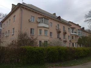 a large building with a balcony on the side of it at Apartment on Dubenskaya street in Rivne