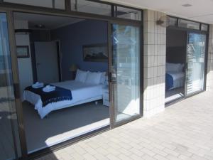 Postel nebo postele na pokoji v ubytování An Der Mole Apartment