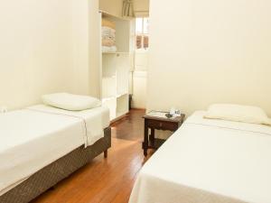 Hotel Caldas da Imperatriz tesisinde bir odada yatak veya yataklar