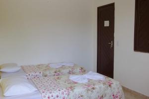 Postel nebo postele na pokoji v ubytování POUSADA DA ILHA