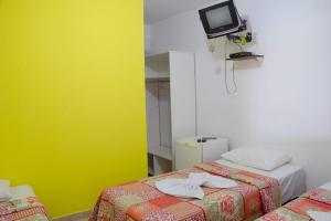 Postel nebo postele na pokoji v ubytování POUSADA DA ILHA