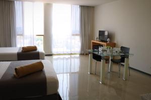 TV a/nebo společenská místnost v ubytování Hotel Suites Bernini