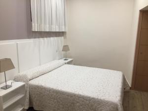 Posteľ alebo postele v izbe v ubytovaní Hostal Infantes