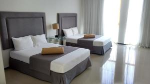 Postel nebo postele na pokoji v ubytování Hotel Suites Bernini