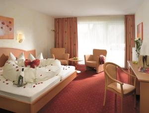 Postel nebo postele na pokoji v ubytování Flair Hotel Werbetal