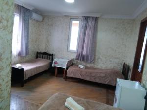 Katil atau katil-katil dalam bilik di Guest House Nika & Nina