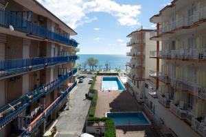 an aerial view of buildings and a swimming pool at Panorama Host - Domus Amalfi Coast in Maiori