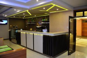 a bar in a restaurant with a counter top at Razana Hotel in Nairobi