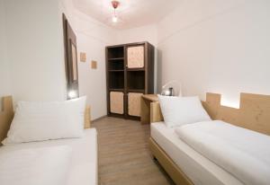 Postel nebo postele na pokoji v ubytování Family Hotel Schloss Rosenegg