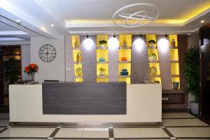 a lobby of a hotel with a reception desk at Razana Hotel in Nairobi