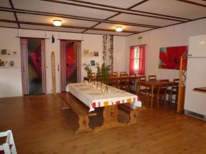 a dining room with a table in the middle at Valle vandrarhem och camping in Axvall +43 photos