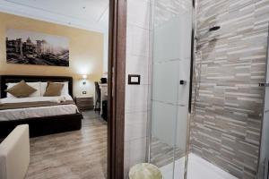 A bed or beds in a room at Noemi's rooms Guest House