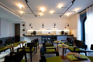a restaurant with tables and chairs and a counter at Maison Bon Bon in Sorrento