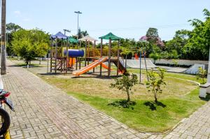 a park with a playground with a slide at Pousada Vila Regina in Penha