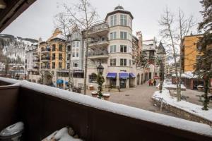 a view from a balcony of a street with buildings at Lionshead Arcade with Fireplace & Close to Gondola in Vail
