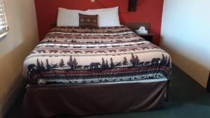 Postel nebo postele na pokoji v ubytování Bryce Canyon Motel