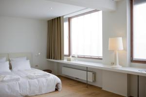 Lova arba lovos apgyvendinimo įstaigoje Hotel Wu Wei