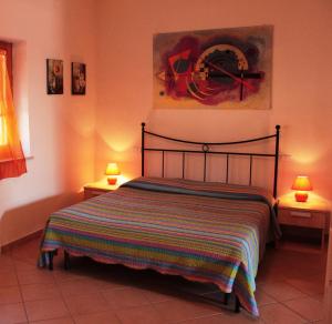 เตียงในห้องที่ Agriturismo IL CANTINIERE