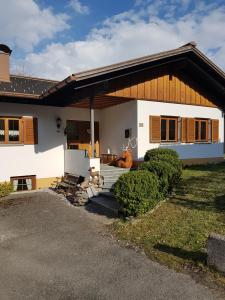 a large white house with a porch at Montafon Alpen Chalet in Vandans