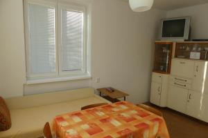 a small room with a bed and a window at Pacov 501 in Pacov