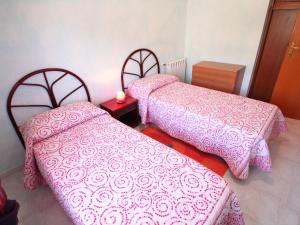 A bed or beds in a room at Holiday Home Is Molas by Interhome