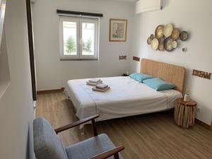 Ένα ή περισσότερα κρεβάτια σε δωμάτιο στο Seaside Place Cascais
