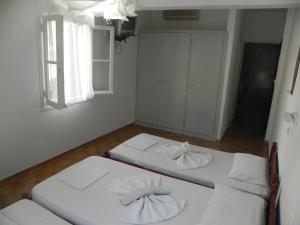 Postel nebo postele na pokoji v ubytování Nefeli rooms Ios