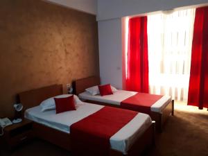 Postel nebo postele na pokoji v ubytování Hotel Flormang