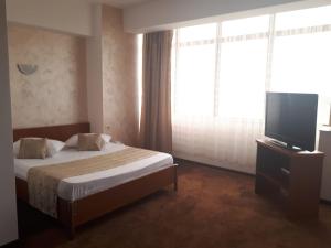 Postel nebo postele na pokoji v ubytování Hotel Flormang