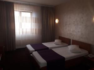 Postel nebo postele na pokoji v ubytování Hotel Flormang