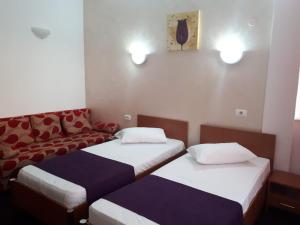 Postel nebo postele na pokoji v ubytování Hotel Flormang