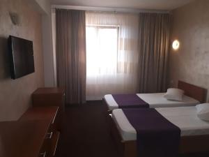 Postel nebo postele na pokoji v ubytování Hotel Flormang