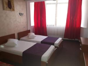Postel nebo postele na pokoji v ubytování Hotel Flormang