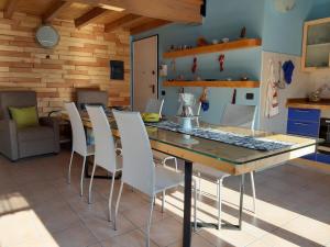 a kitchen and dining room with a table and chairs at Ca' De' Mumi in Luino